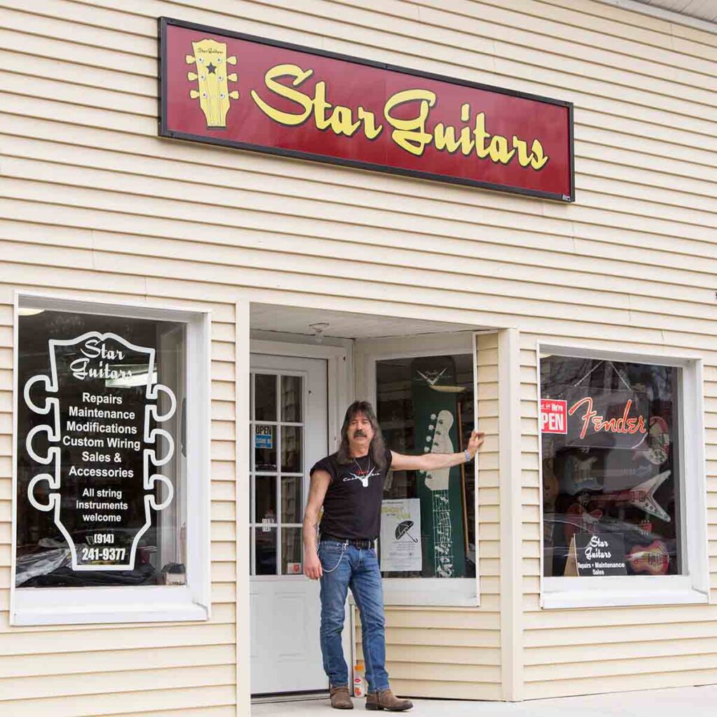 John Carlino standing outside Star Guitars store